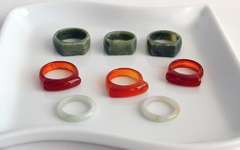 Lot of 8 Carved Jade Rings: Green, Brown and White