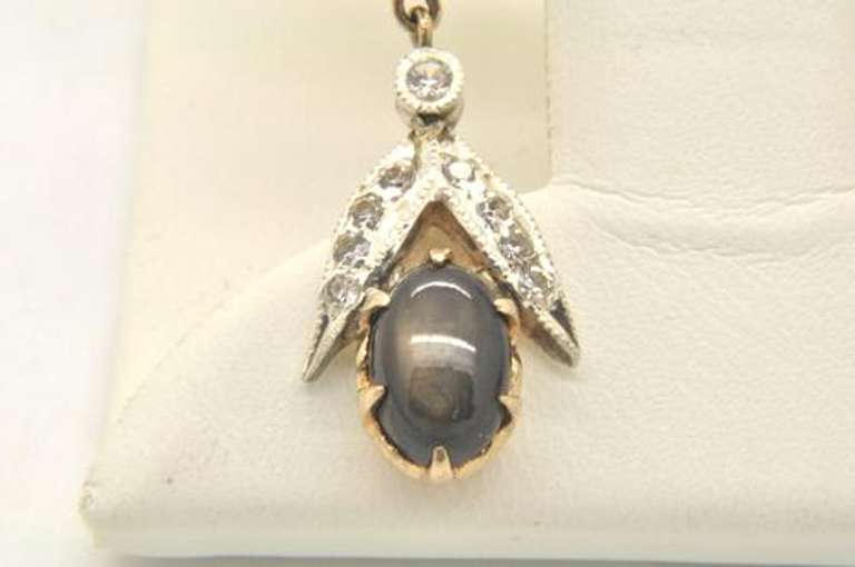 LADIES 18 KT YELLOW AND WHITE GOLD DIAMOND STAR SAPPHIR