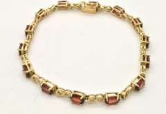 LADIES 14 KT GOLD GARNET BRACELET