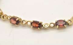 LADIES 14 KT GOLD GARNET BRACELET
