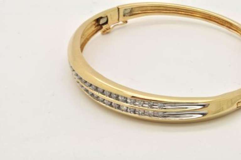 LADIES 14K  GOLD AND DIAMOND  BANGLE