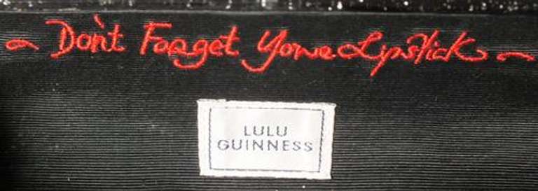 Lulu Gunnes black purse " don't forget lipstick "