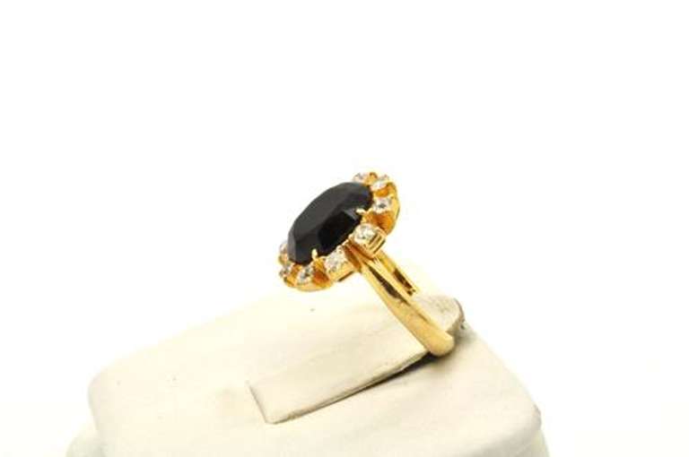 LADIES 18 KT SAPPHIRE AND DIAMOND RING