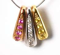 Useful Group of 18k Slider Pendants