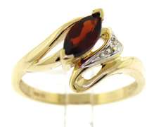 Beautiful Yellow Gold Marquise Cut Garnet and Diamond Bypass Ring