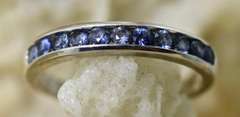 Desirable 18K White Gold Channel Set Sapphire Band