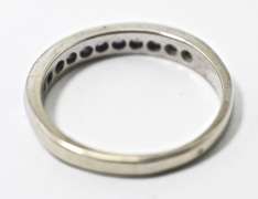 Desirable 18K White Gold Channel Set Sapphire Band