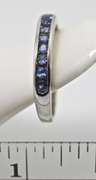 Desirable 18K White Gold Channel Set Sapphire Band