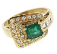 Glowing Emerald and Diamond Buckle Style Ring