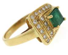 Glowing Emerald and Diamond Buckle Style Ring