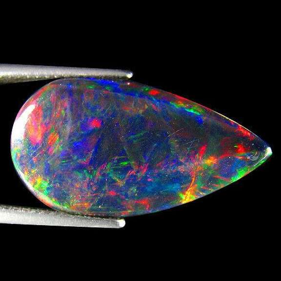 Silky black 9.42ct rainbow flashing Black Opal