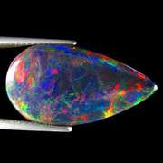 Silky black 9.42ct rainbow flashing Black Opal
