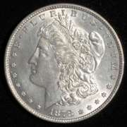 BU 1878 Reverse of 79 7 Tail Feathers Morgan Dollar