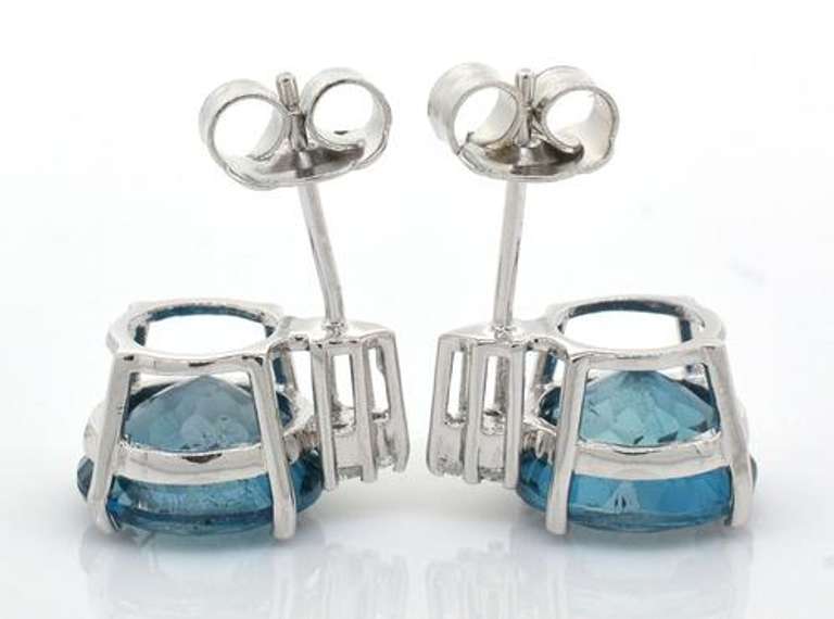 Beautiful 9.24CTW Blue Topaz Adorned with White Topaz Earrings