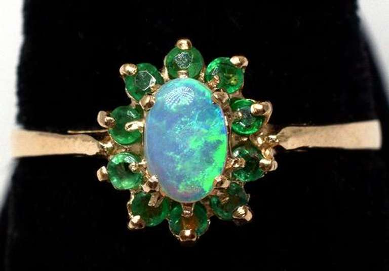 Beautiful Opal & Emerald Halo Ring in Yellow Gold