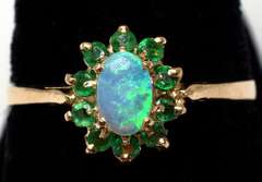 Beautiful Opal & Emerald Halo Ring in Yellow Gold