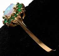 Beautiful Opal & Emerald Halo Ring in Yellow Gold