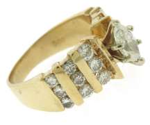Dazzling Marquise Center w Bar Channel Diamond Band