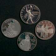 4 Modern Proof Silver Dollars In Capsules