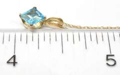 Gorgeous Blue Topaz Pendant & Chain in Yellow Gold