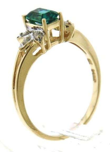 Exquisite Synthetic Emerald & Starburst Diamond Accent Ring