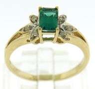 Exquisite Synthetic Emerald & Starburst Diamond Accent Ring