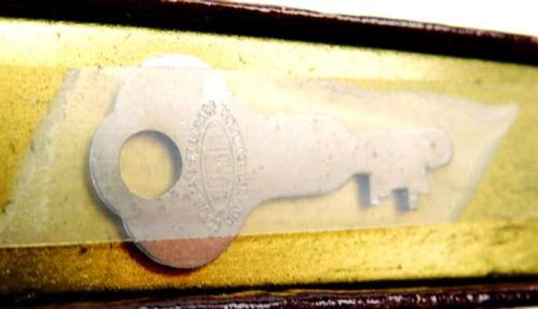 Vintage Metal Advertising Bank with Key