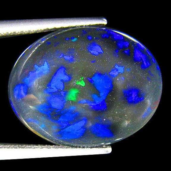 Liquid flashing 8.17ct silky black Opal
