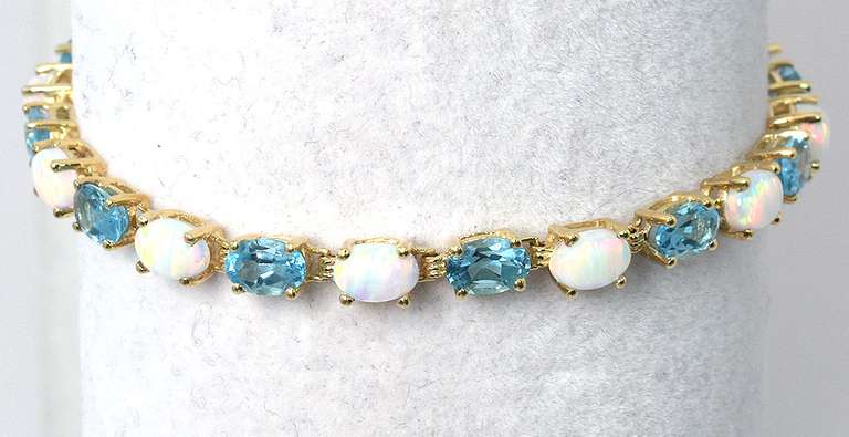 Charming Topaz & Opal Bracelet in Yellow Gold