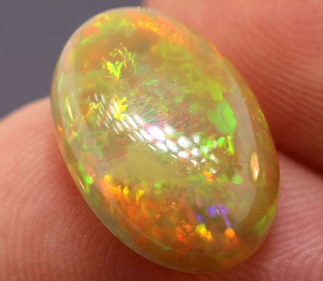 Magnificent 4.58ct full body flashing Semi Black Opal