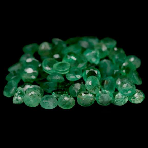 Rich emerald green 7.35ct 63pc emerald set