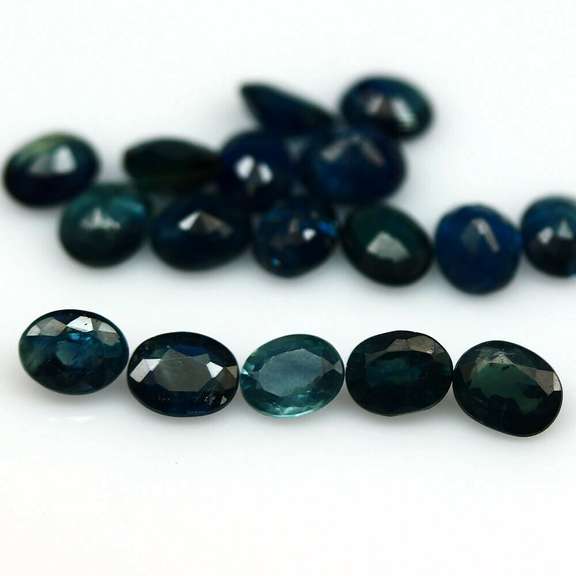 Heated only! 7.48ct deep blue sapphire set