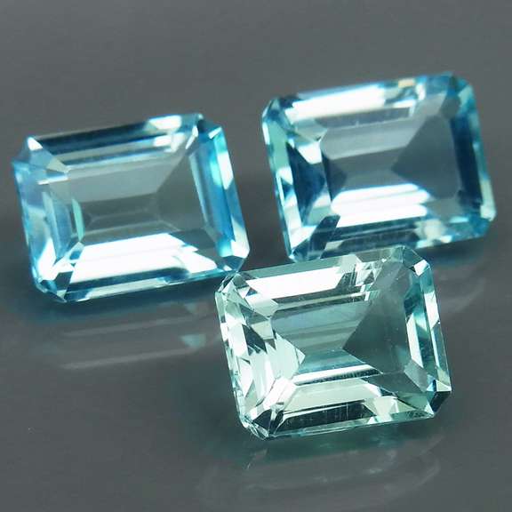 Eye clean 8.23ct vivid blue emerald cut Topaz set