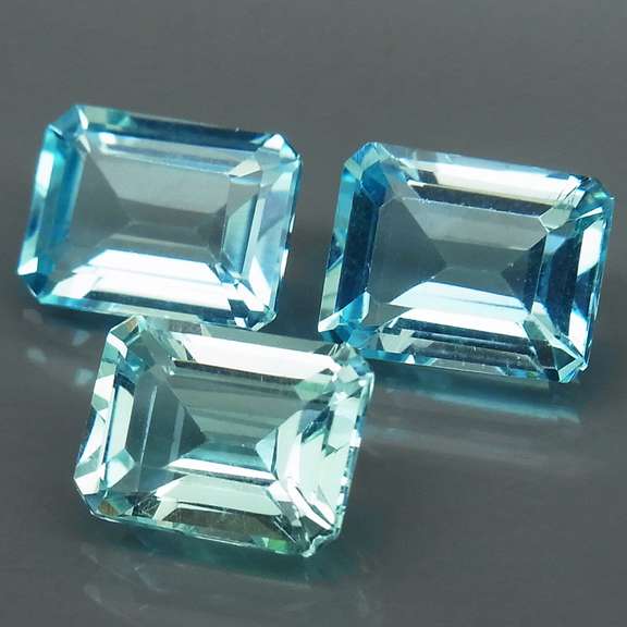 Eye clean 8.25ct vivid blue emerald cut Topaz set