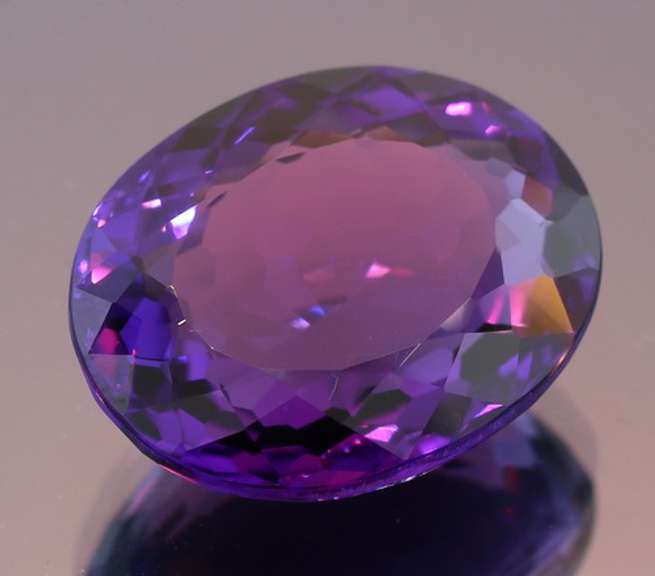 Oval cut 17.60ct royal purple created Amethyst