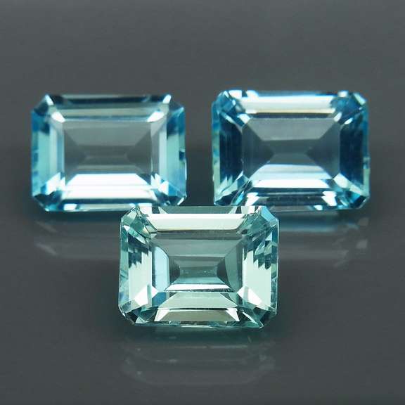 Eye clean 8.25ct vivid blue emerald cut Topaz set