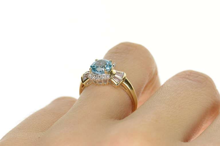10K Yellow Gold Oval Blue Topaz Cubic Zirconia Halo Ring