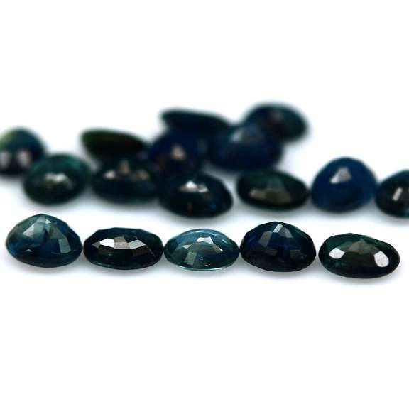 Heated only! 7.48ct deep blue sapphire set