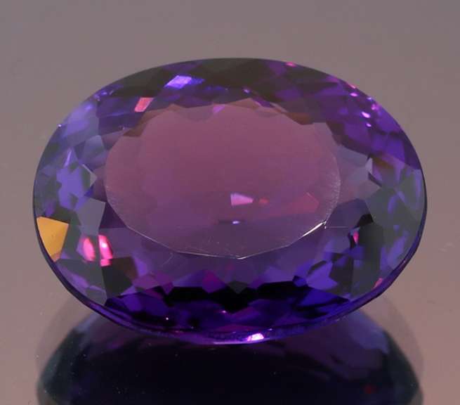 Oval cut 17.60ct royal purple created Amethyst