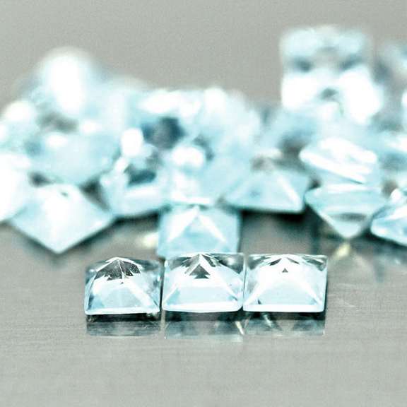 Amazing 4.81ct radiant cut ice blue Topaz set