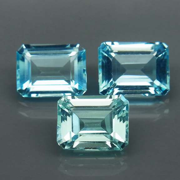 Eye clean 8.23ct vivid blue emerald cut Topaz set