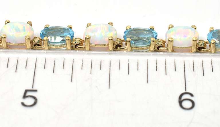 Charming Topaz & Opal Bracelet in Yellow Gold