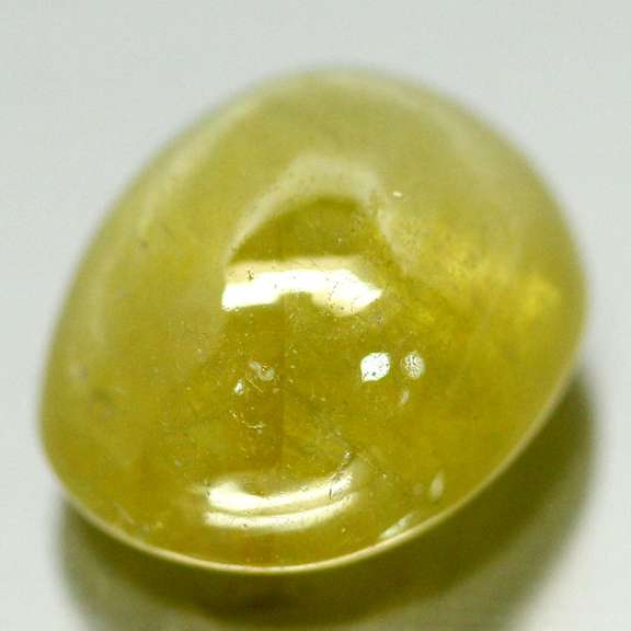 Mirror luster 11.20ct Sphene cabochon
