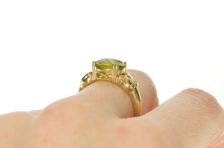 10K Yellow Gold Faceted Oval Peridot Scroll Filigree Ring
