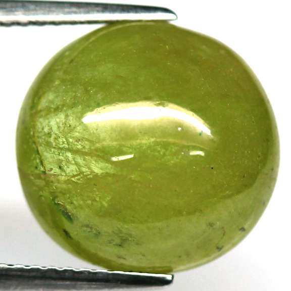Mirror luster 10.58ct Sphene cabochon