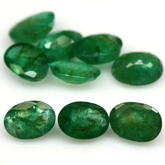 Rich emerald green 6.44ct 9pc emerald set