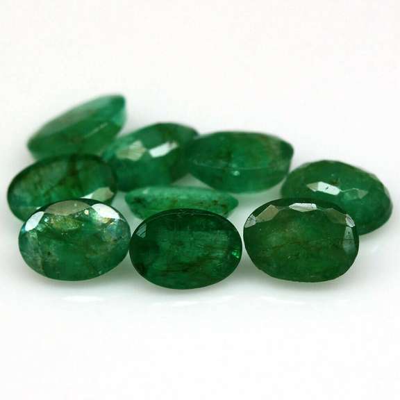 Rich emerald green 6.44ct 9pc emerald set