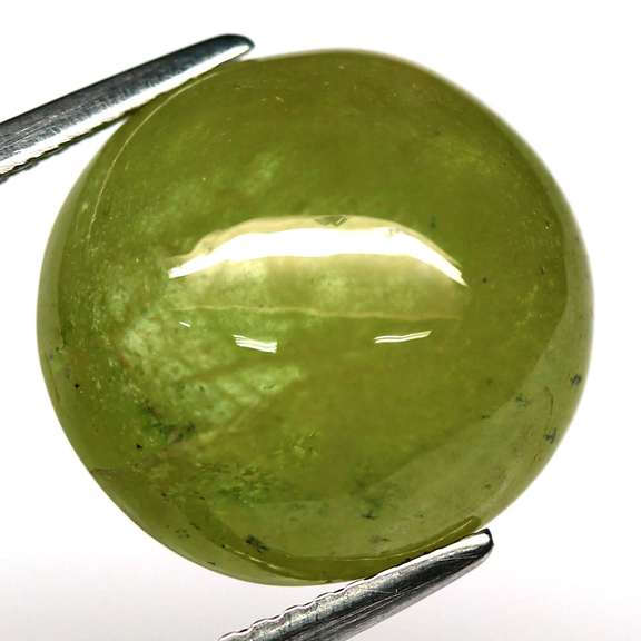 Mirror luster 10.58ct Sphene cabochon