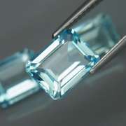 Eye clean 8.23ct vivid blue emerald cut Topaz set