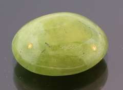 Mirror luster 9.44ct Sphene cabochon